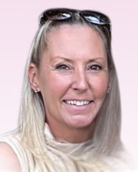 Smiling woman with sunglasses on head