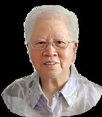 Portrait of smiling elderly person with glasses.