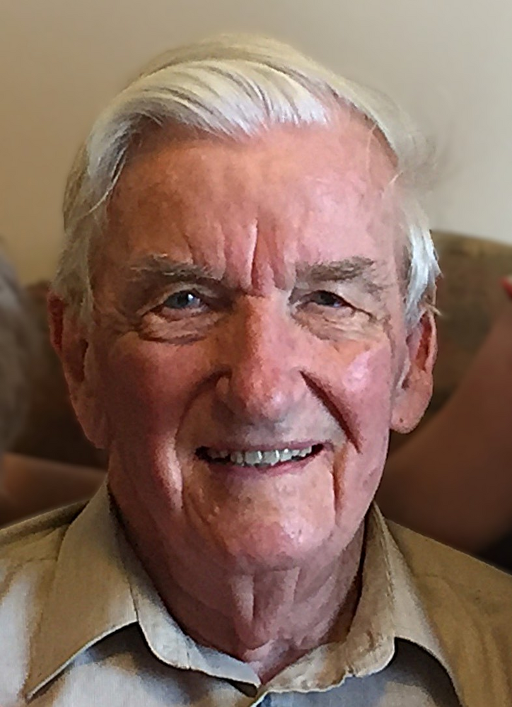 Smiling elderly man with gray hair and shirt