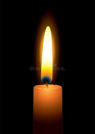 Bright candle flame in darkness
