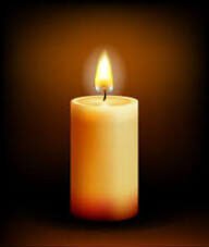 Burning candle with a warm glow.