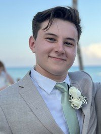 Young man in suit at outdoor event