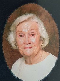 Smiling elderly woman with short white hair portrait.