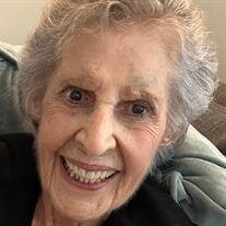 Elderly woman smiling at camera on chair