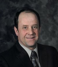 Professional portrait of a man in suit and tie