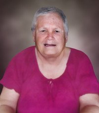 Smiling woman in a pink blouse