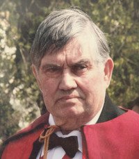 Elderly man in formal attire outdoors.