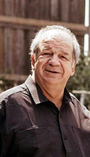 Smiling elderly man outdoors in casual shirt