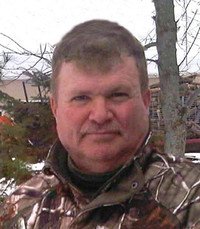 Man in camo jacket outdoors in winter