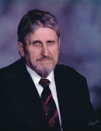 Man in suit and tie, portrait photograph.