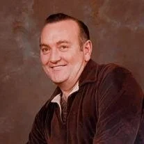 Smiling man in brown jacket portrait