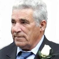 Elderly man in suit with white rose boutonniere