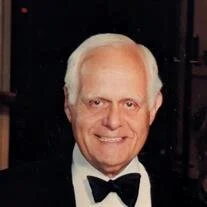 Smiling elderly man in a tuxedo