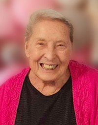 Smiling elderly woman in vibrant pink jacket