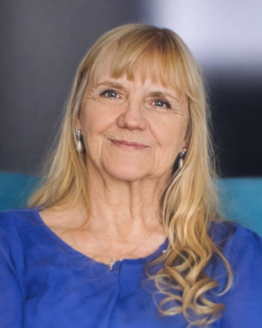 Smiling woman in blue blouse and long hair