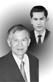 Two men in formal suits, black and white portrait.