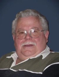 Smiling older man with glasses and mustache