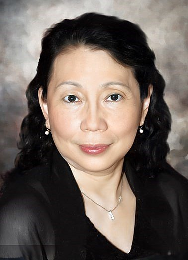Portrait of a woman in black attire.