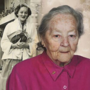 Elderly woman with vintage photo in background.