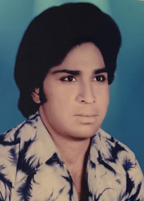 Portrait of a man with 1970s hairstyle.
