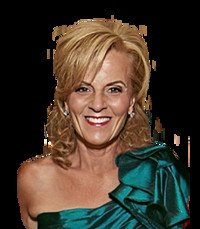 Smiling woman in emerald green dress
