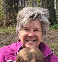 Smiling woman outdoors.