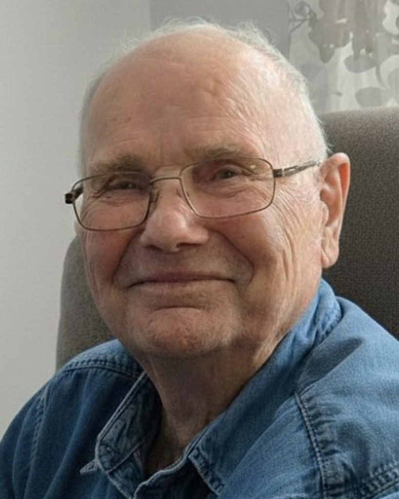FERRIER, Lloyd David Ferrier Smiling elderly man wearing glasses indoors
