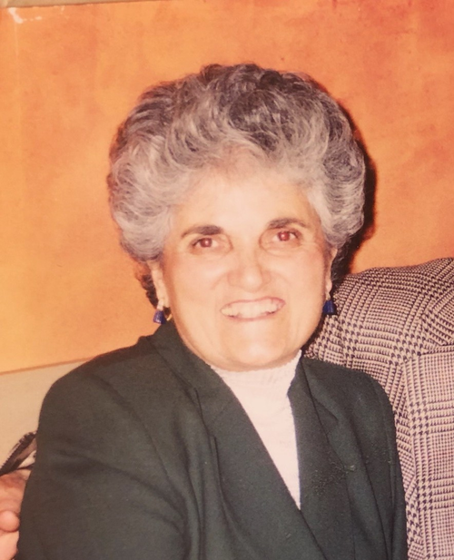 Smiling elderly woman with gray hair.