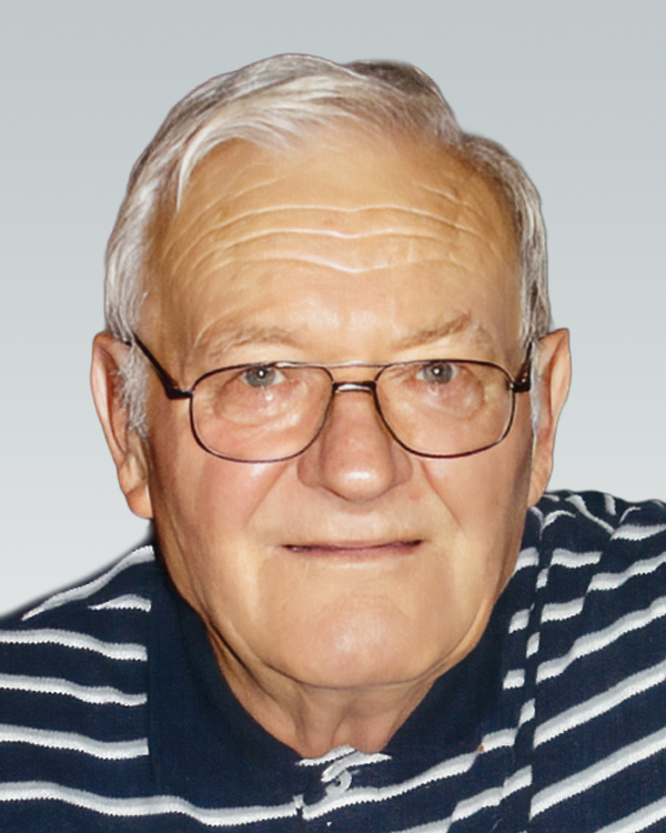 FABBRO, Lino Natale Fabbro Older man in glasses and striped shirt smiling.
