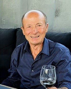 Smiling man holding a wine glass