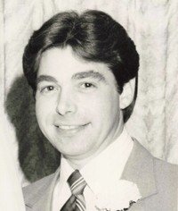 Smiling man in suit at formal event