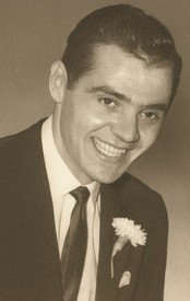 Smiling man in suit with flower lapel