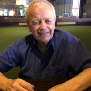 Smiling man sitting in a restaurant