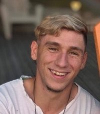 BILKEY, Luke Thomas Bilkey Smiling person outdoors with short blonde hair.