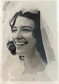 Smiling bride with veil and curly hair