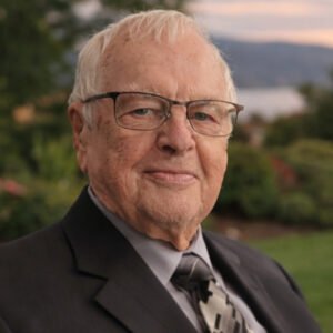 Elderly man in suit with natural background