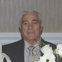 Elderly man wearing a suit at an event