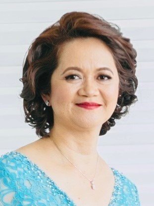 Woman smiling in blue dress