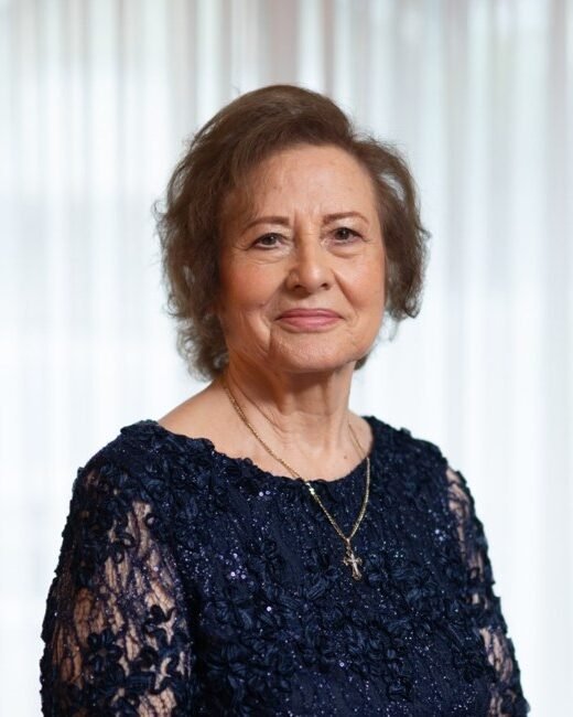 Elderly woman smiling in elegant dress