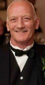 Smiling person in formal attire