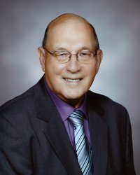 Smiling man in suit and glasses portrait