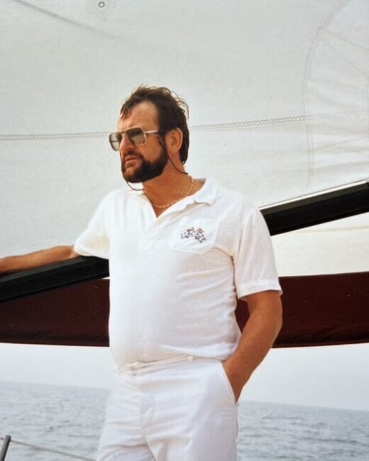 Man in white sailing on a yacht