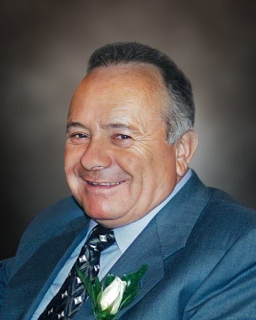 MAURO, Francesco “Frank” Mauro Smiling man in suit with boutonniere