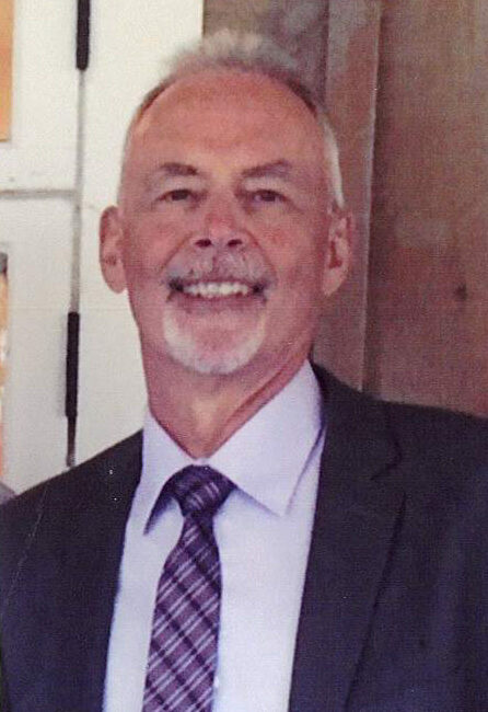Smiling man in suit and tie