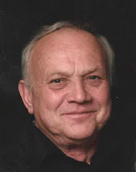 Smiling older man with short gray hair