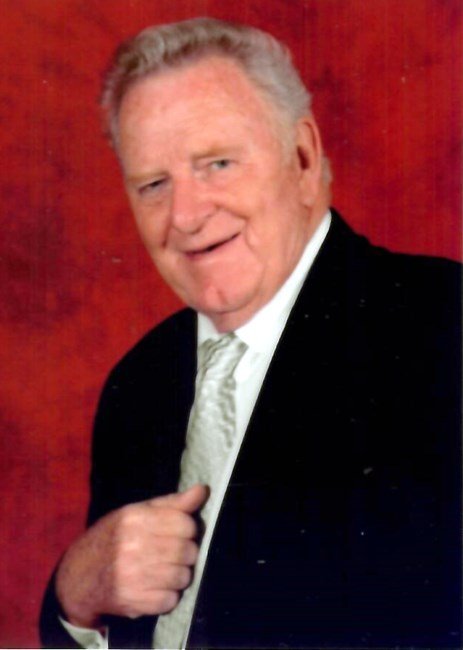 Smiling elderly man in suit and tie portrait.