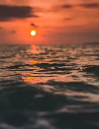DESAI, Jayeshkumar Desai Sunset over ocean waves, dramatic sky