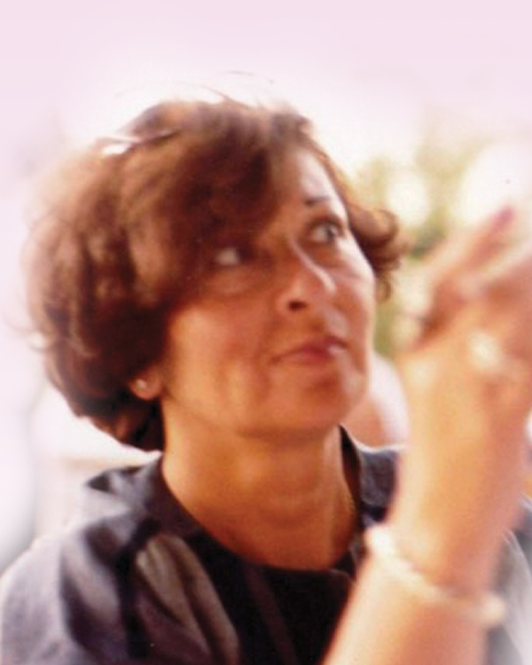 ESTEPHAN, Odette Estephan Woman looking up, blurred background.