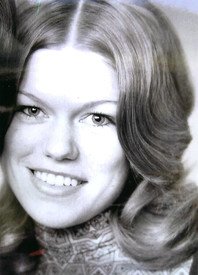 Smiling person with long hair in vintage photo