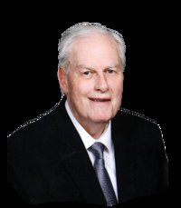 Elderly man in suit smiling against black background.